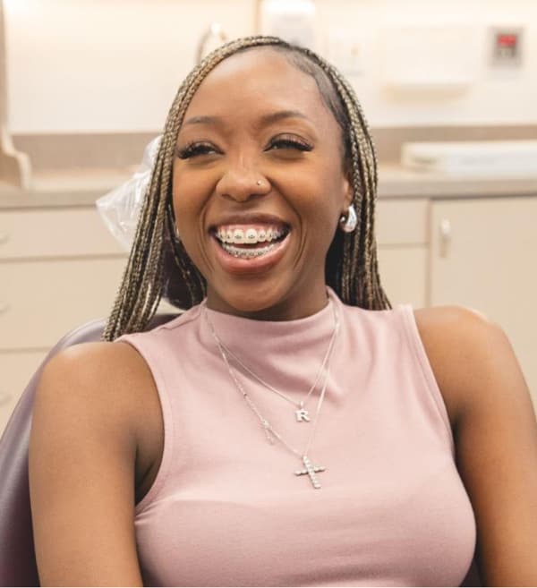 patient smiling with braces on