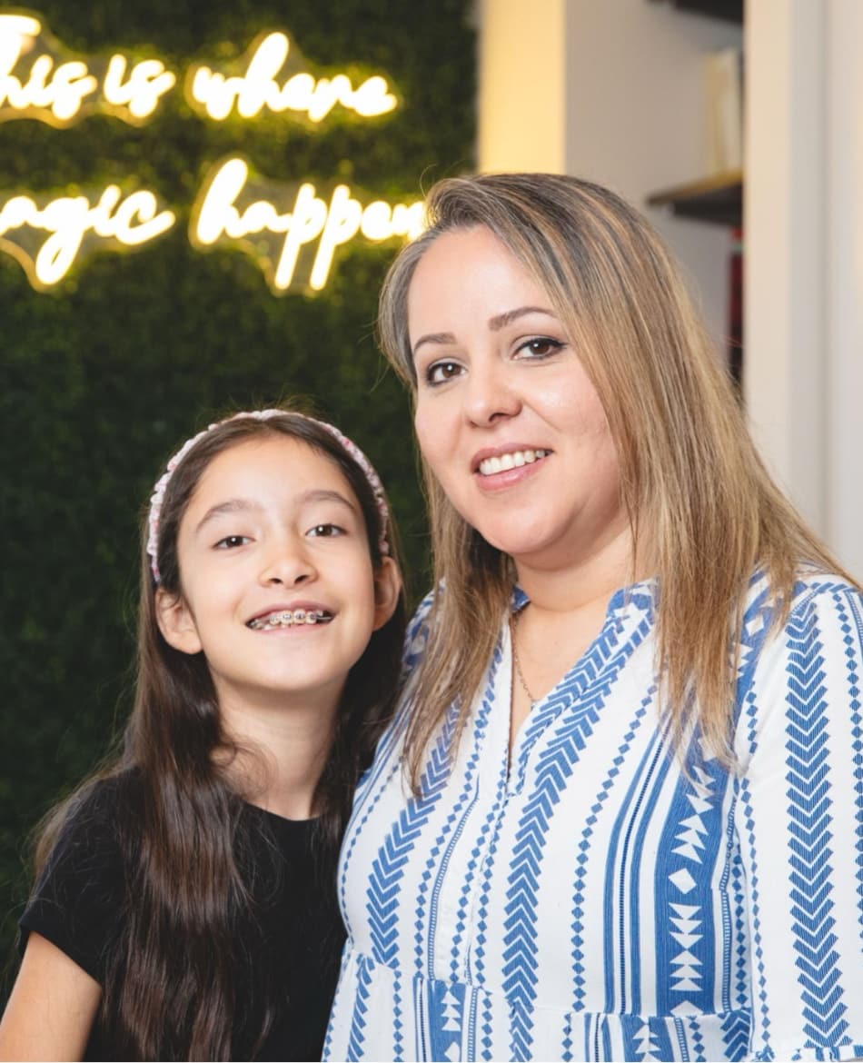 mother and daughter smiling during appointment
